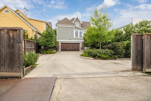 1101 Heights Blvd, Houston, TX 77008 - view of property exterior featuring an attached garage, driveway, and brick siding