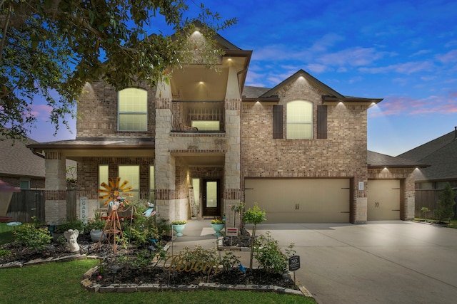 7611 Mesquite Hill Ln, Richmond, TX 77469 - view of front facade with brick siding, driveway, an attached garage, and stone siding
