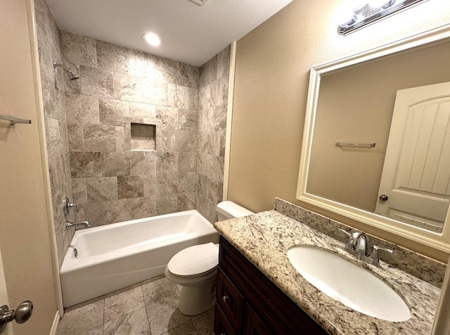 bathroom featuring toilet, shower / tub combination, and vanity