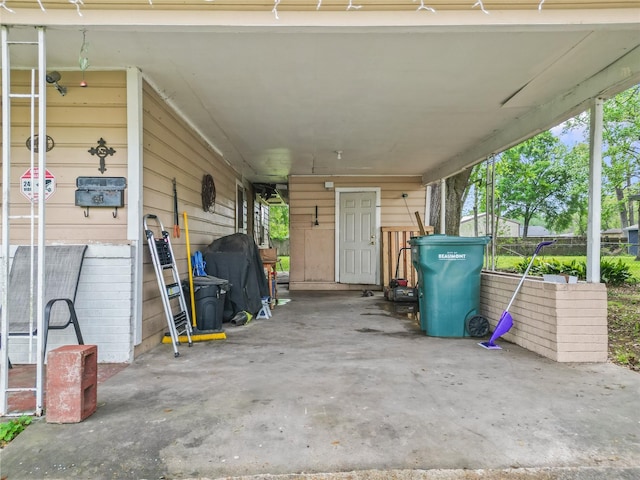 7135 Click Dr, Beaumont, TX 77708 - view of car parking with a carport