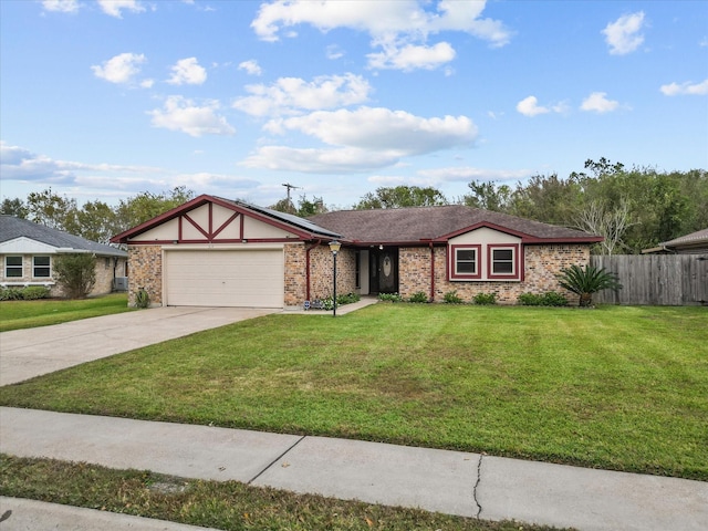 314 Lantana Dr, Texas City, TX 77591 - view of front of property with driveway, fence, a front lawn, solar panels, and a garage