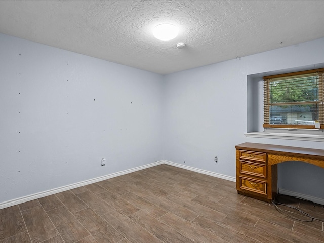 314 Lantana Dr, Texas City, TX 77591 - interior space featuring a textured ceiling, baseboards, and wood finished floors