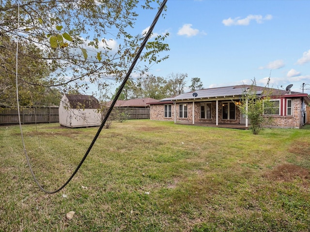 314 Lantana Dr, Texas City, TX 77591 - view of yard with a fenced backyard, an outbuilding, and a shed