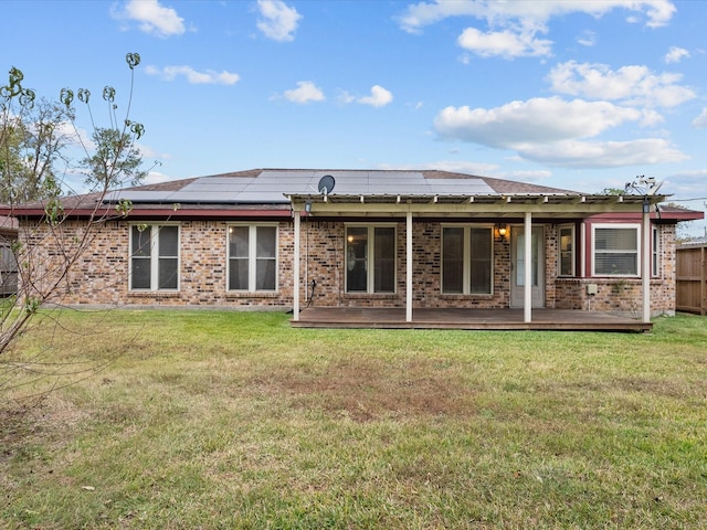 314 Lantana Dr, Texas City, TX 77591 - back of house featuring brick siding, a deck, and a yard