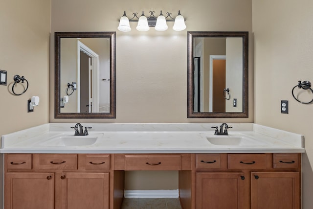 full bathroom featuring double vanity, tile patterned floors, and a sink
