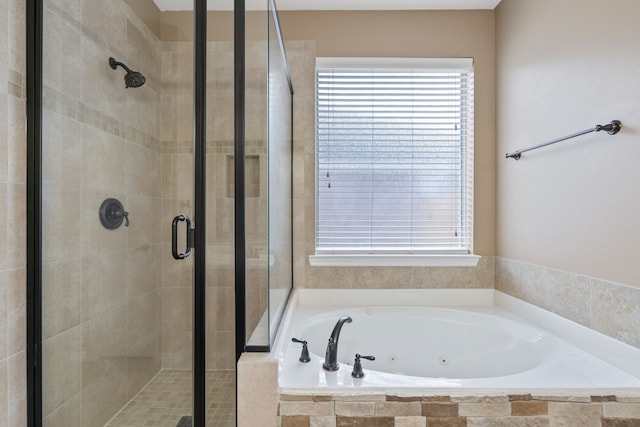 full bathroom with a jetted tub and a stall shower