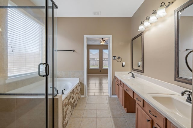 full bathroom featuring a sink, a bath, tile patterned flooring, and ceiling fan