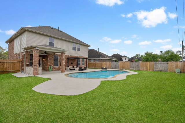 view of pool featuring a fenced backyard, a ceiling fan, a patio, and a yard