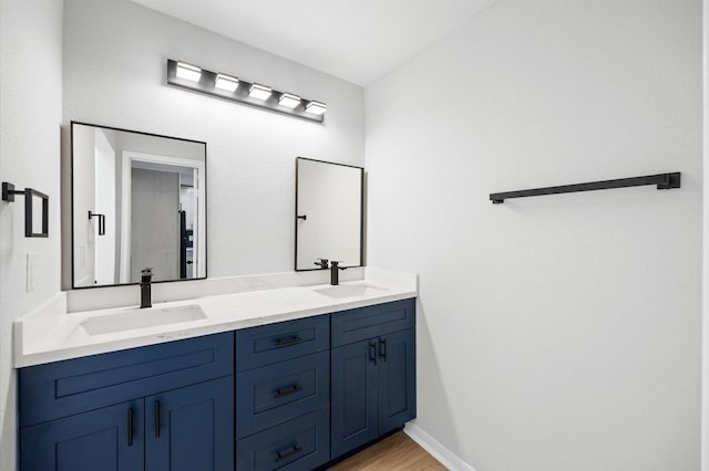 16800 Sugar Pine Dr Unit F51, Houston, TX 77090 - full bath featuring a sink, double vanity, and wood finished floors