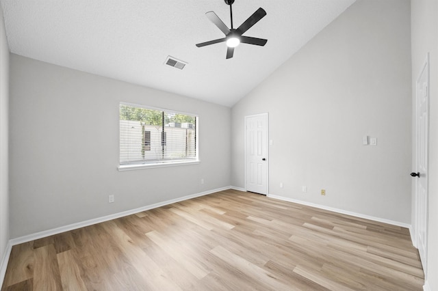 16800 Sugar Pine Dr Unit F51, Houston, TX 77090 - empty room with baseboards, a ceiling fan, light wood-style floors, visible vents, and high vaulted ceiling