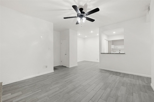 5001 Lamonte Ln Unit 110, Houston, TX 77092 - unfurnished living room with wood finished floors, ceiling fan, baseboards, visible vents, and recessed lighting