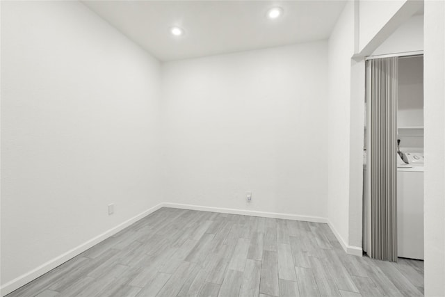 5001 Lamonte Ln Unit 110, Houston, TX 77092 - empty room featuring recessed lighting, washer and dryer, baseboards, and light wood-type flooring