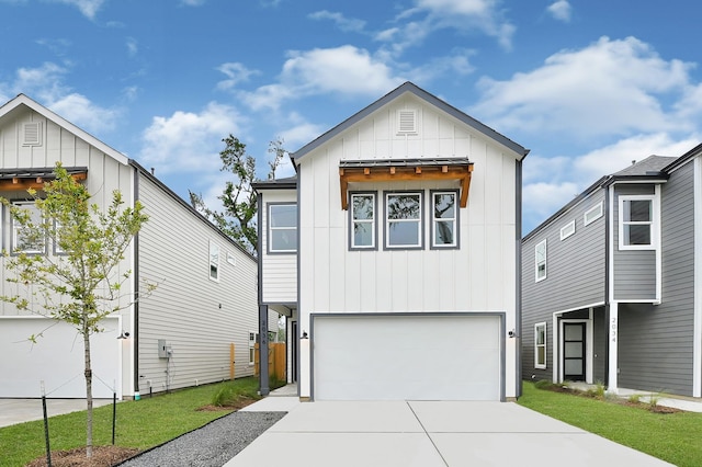 view of front of property with a garage, board and batten siding, and concrete driveway