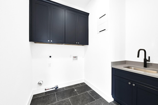 clothes washing area with hookup for a gas dryer, a sink, washer hookup, electric dryer hookup, and cabinet space