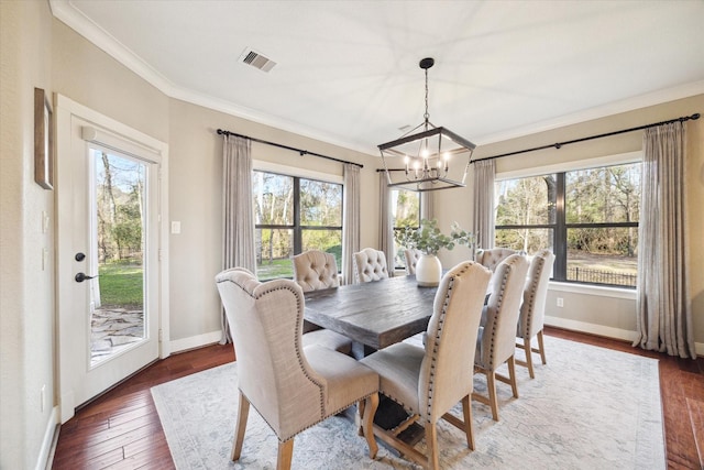 271 W Pines Dr, Montgomery, TX 77356 - dining room featuring a chandelier, ornamental molding, baseboards, and dark wood-type flooring