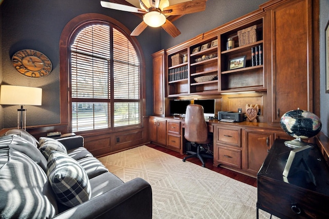 271 W Pines Dr, Montgomery, TX 77356 - office with built in desk, a ceiling fan, and light wood-style floors