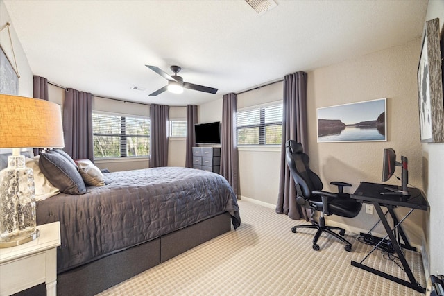 271 W Pines Dr, Montgomery, TX 77356 - carpeted bedroom with baseboards, a ceiling fan, a textured wall, and a desk
