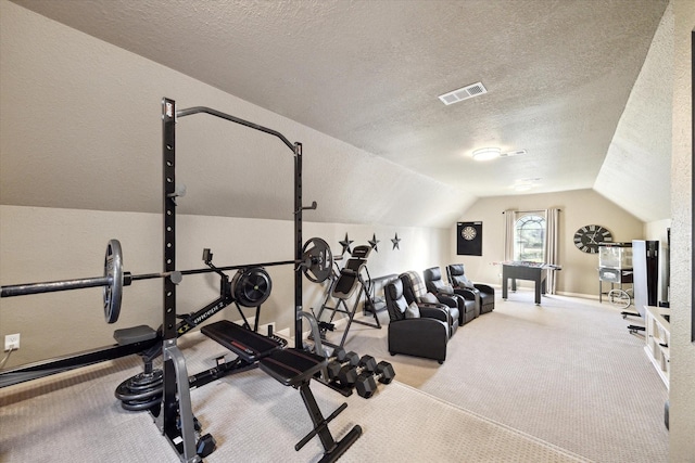 271 W Pines Dr, Montgomery, TX 77356 - workout area featuring a textured ceiling, vaulted ceiling, carpet, and baseboards