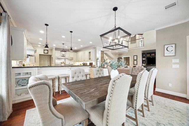 271 W Pines Dr, Montgomery, TX 77356 - dining room with a chandelier, dark wood-style floors, recessed lighting, baseboards, and crown molding