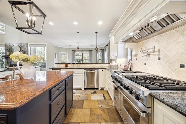 271 W Pines Dr, Montgomery, TX 77356 - kitchen with stainless steel appliances, custom range hood, stone tile flooring, white cabinets, and backsplash