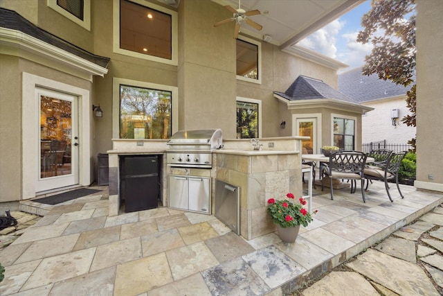 271 W Pines Dr, Montgomery, TX 77356 - view of patio with grilling area, an outdoor kitchen, a ceiling fan, outdoor dining area, and a sink