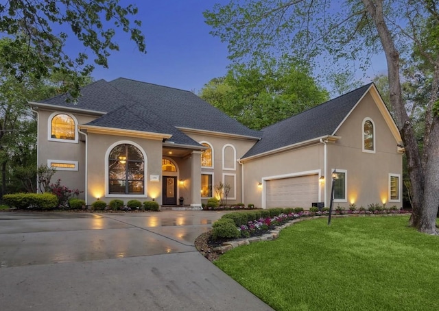 271 W Pines Dr, Montgomery, TX 77356 - view of front facade with stucco siding, a front lawn, roof with shingles, concrete driveway, and an attached garage