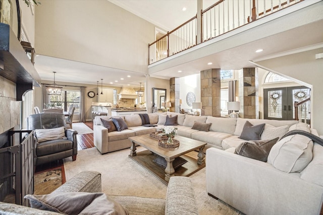 271 W Pines Dr, Montgomery, TX 77356 - living area with ornamental molding, a towering ceiling, recessed lighting, and light wood-style floors