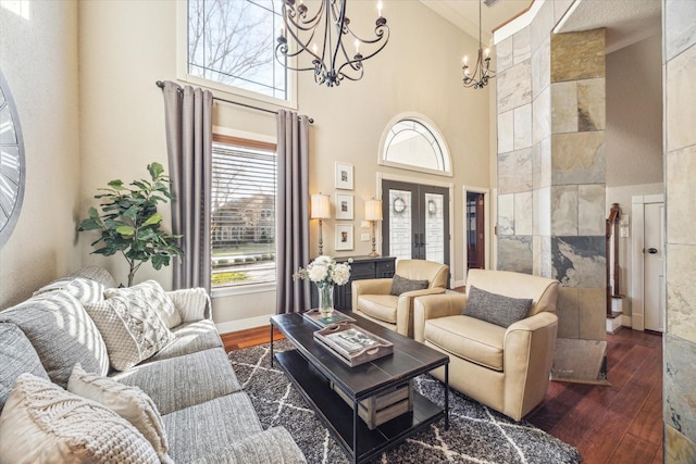 271 W Pines Dr, Montgomery, TX 77356 - living area featuring a chandelier, a high ceiling, hardwood / wood-style floors, french doors, and baseboards