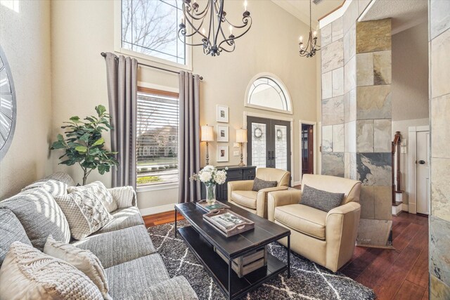 271 W Pines Dr, Montgomery, TX 77356 - living area with a chandelier, a towering ceiling, wood-type flooring, and french doors