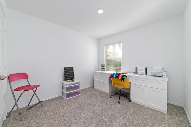 home office with light carpet and baseboards