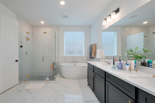 9603 Crescent Mill Dr, Missouri City, TX 77459 - full bathroom featuring a shower stall, a freestanding tub, marble finish floor, and a sink