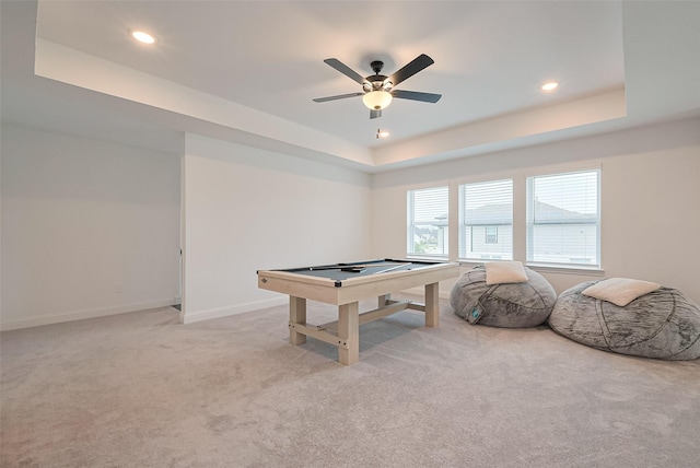 9603 Crescent Mill Dr, Missouri City, TX 77459 - rec room featuring a tray ceiling, light colored carpet, ceiling fan, and baseboards