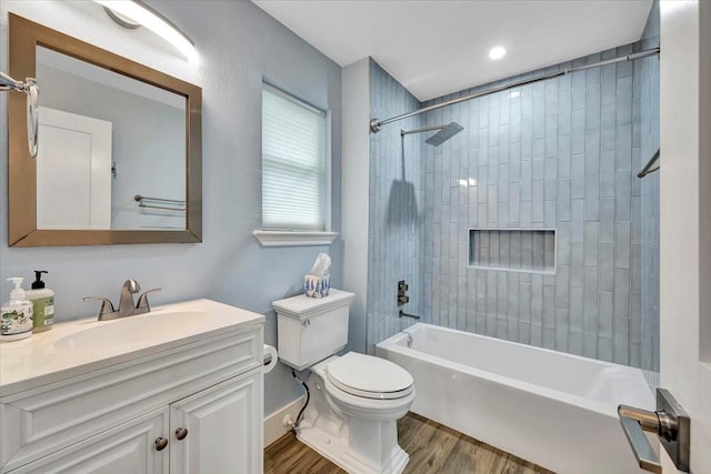 126 Tamana Dr, Tiki Island, TX 77554 - bathroom featuring toilet, washtub / shower combination, vanity, and wood finished floors