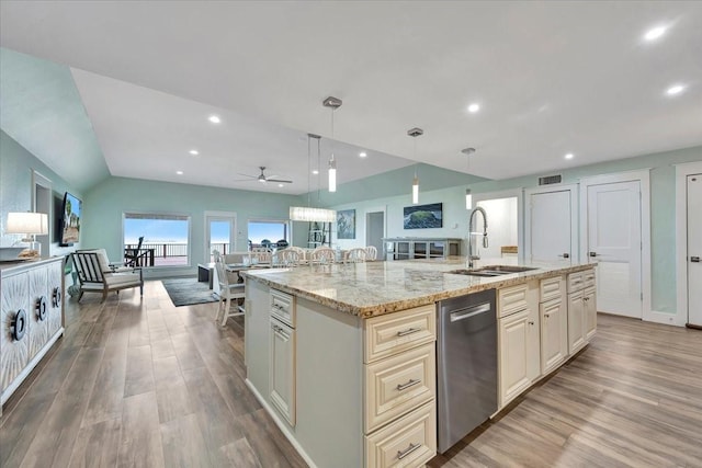 126 Tamana Dr, Tiki Island, TX 77554 - kitchen featuring open floor plan, a sink, light wood-style floors, and visible vents