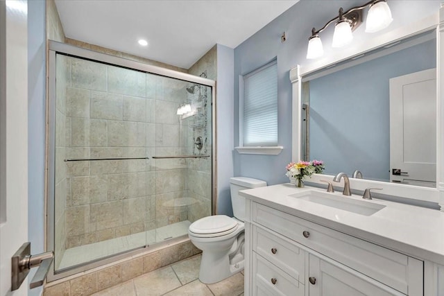 126 Tamana Dr, Tiki Island, TX 77554 - bathroom featuring toilet, vanity, tile patterned floors, and a shower stall