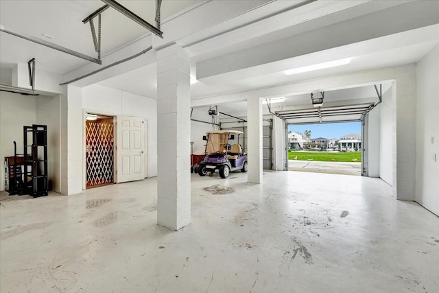 126 Tamana Dr, Tiki Island, TX 77554 - garage featuring a garage door opener