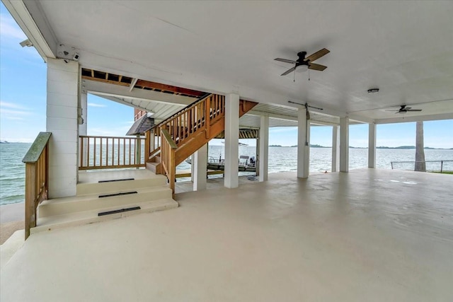 126 Tamana Dr, Tiki Island, TX 77554 - view of patio featuring a ceiling fan, a water view, and stairs
