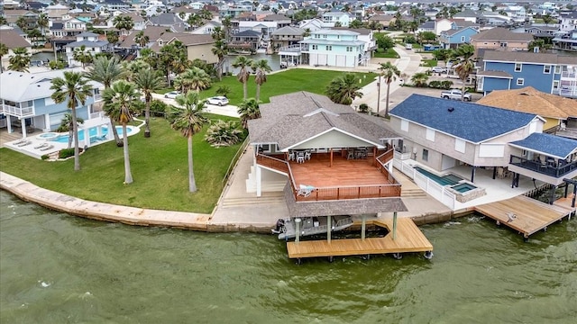126 Tamana Dr, Tiki Island, TX 77554 - birds eye view of property featuring a water view and a residential view
