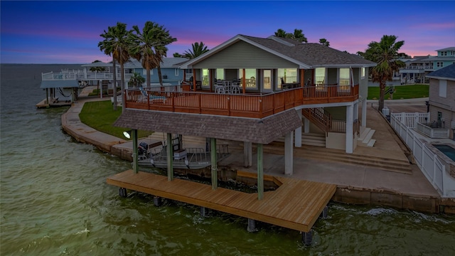 126 Tamana Dr, Tiki Island, TX 77554 - view of dock with a water view and stairway