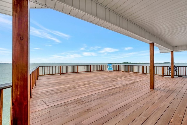 126 Tamana Dr, Tiki Island, TX 77554 - wooden terrace with a water view