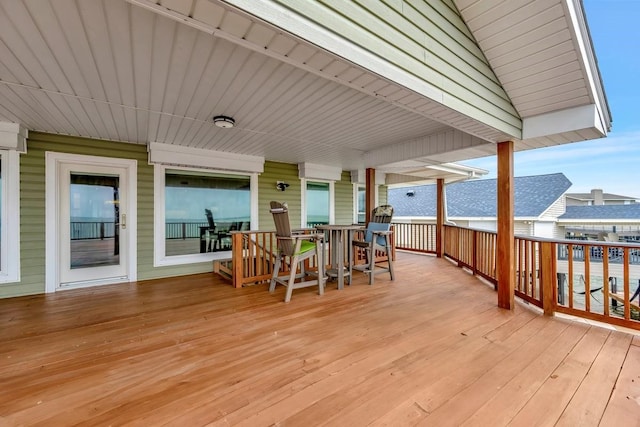 126 Tamana Dr, Tiki Island, TX 77554 - wooden deck featuring outdoor dining area