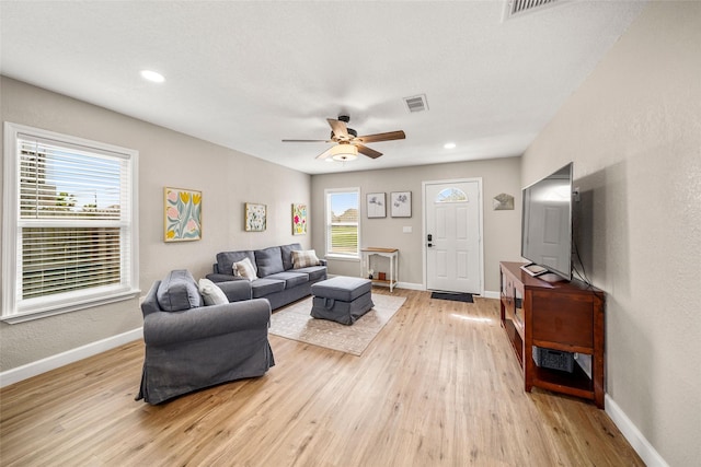 2008 71st St, Galveston, TX 77551 - living area with a ceiling fan, baseboards, light wood-style flooring, and recessed lighting