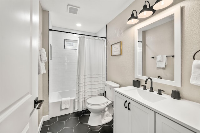 2008 71st St, Galveston, TX 77551 - full bath featuring vanity, toilet, shower / bath combo with shower curtain, tile patterned flooring, and a textured wall