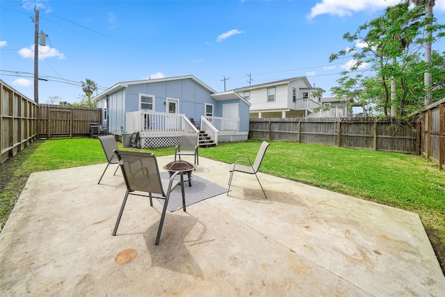 2008 71st St, Galveston, TX 77551 - view of patio with an outdoor fire pit, a wooden deck, and central AC