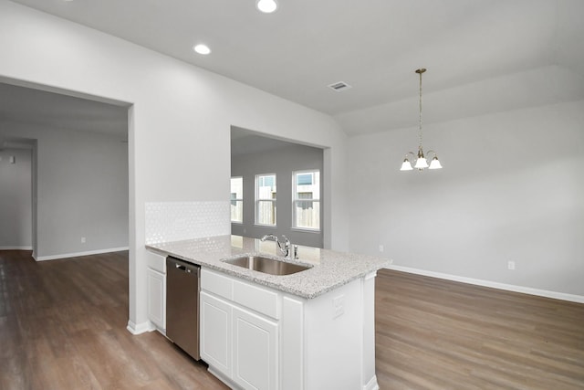 kitchen with white cabinets, light wood finished floors, baseboards, dishwasher, and a sink
