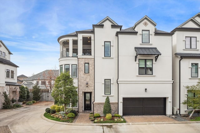 1523 Cunningham Parc Ln, Houston, TX 77055 - view of front of home with stucco siding, brick siding, decorative driveway, and an attached garage