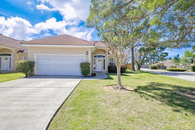 49 Regency Pt, Conroe, TX 77356 - mediterranean / spanish home featuring a tile roof, concrete driveway, stucco siding, an attached garage, and a front lawn