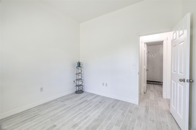 49 Regency Pt, Conroe, TX 77356 - empty room with baseboards and light wood-style floors