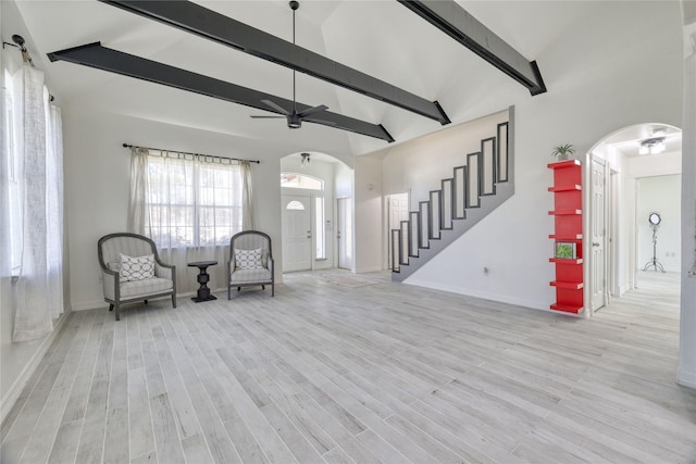 49 Regency Pt, Conroe, TX 77356 - unfurnished room featuring high vaulted ceiling, ceiling fan, wood finished floors, beam ceiling, and arched walkways
