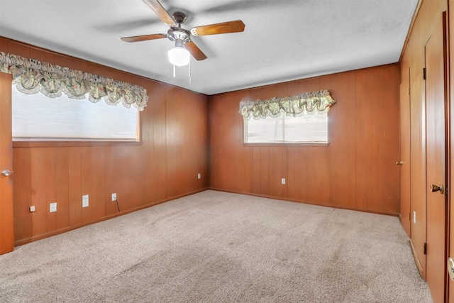 2509 Bayou Ave, Baytown, TX 77520 - unfurnished room featuring plenty of natural light, ceiling fan, and carpet flooring